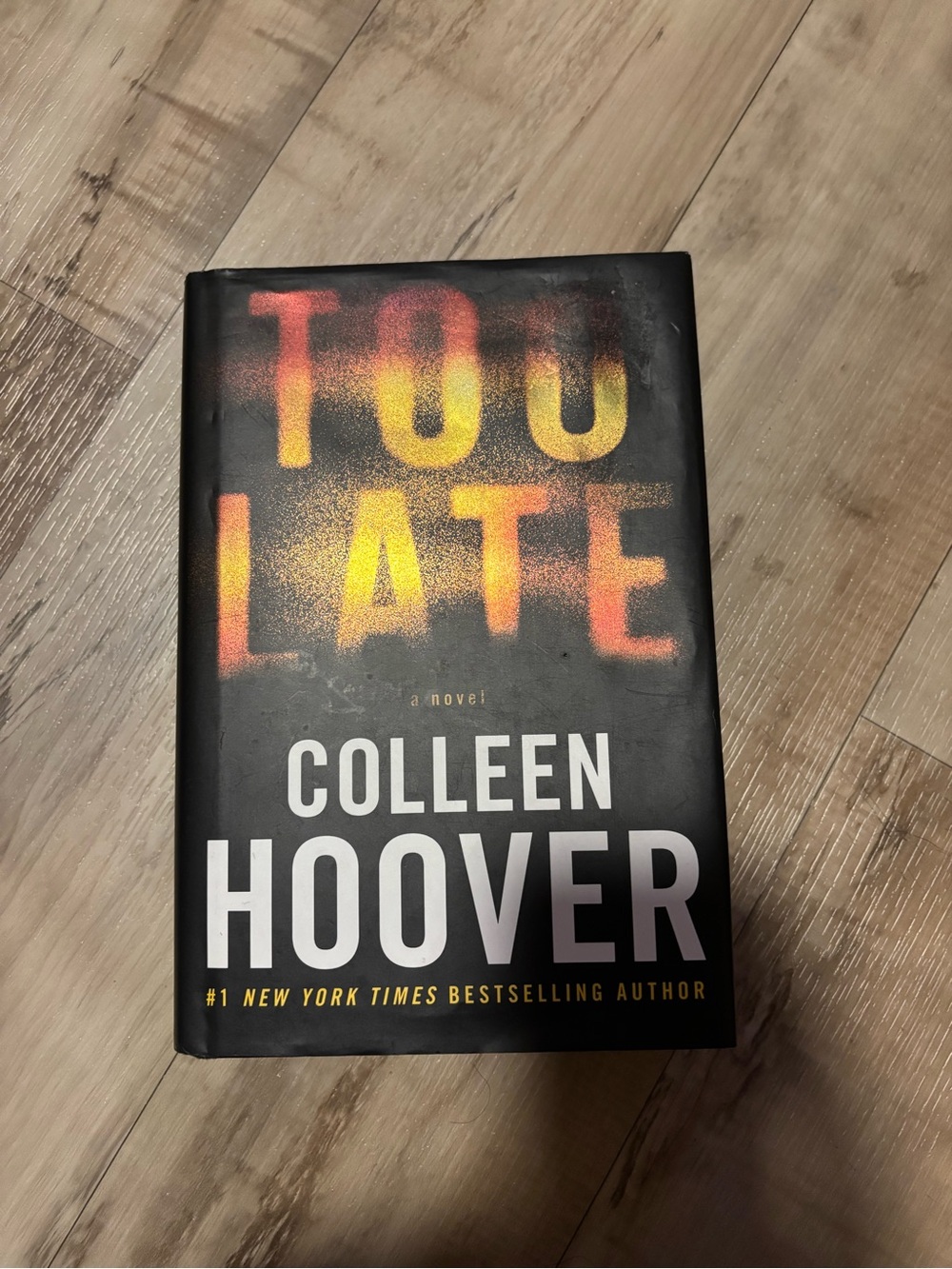 Too Late by Colleen Hoover — Black Cover with Yellow & Orange Spray